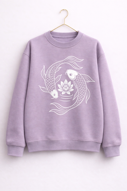 Lavender sweatshirt with white fish and lotus design on a white background